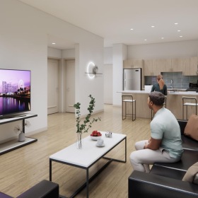 a person sitting on a couch watching tv